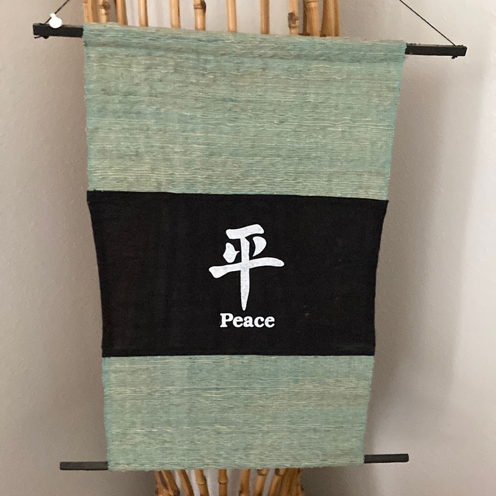 Decor, peace sign in Japanese. Green color with whit writing on black background
